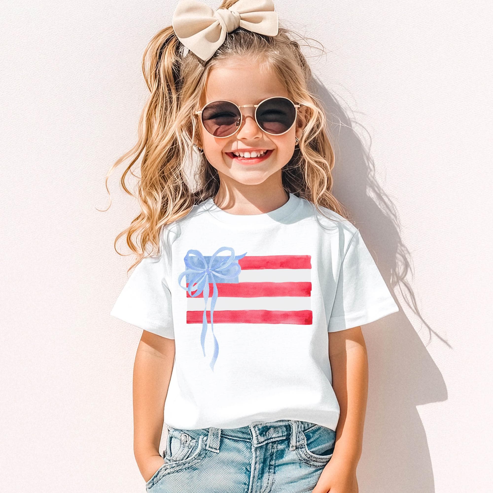 Girls 4th July Shirt – Watercolor American Flag Tee with Blue Bow by The Saltwater Press